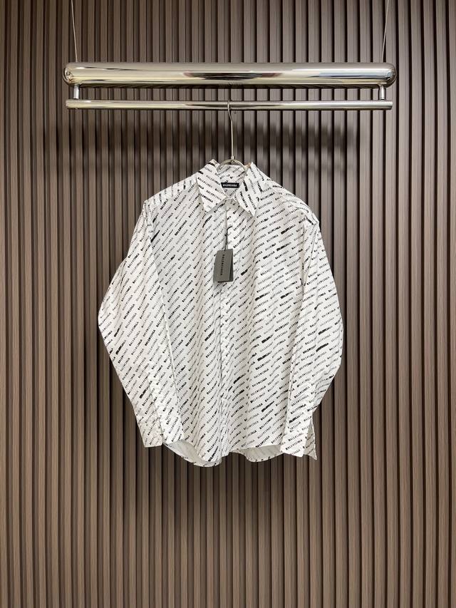 Balenciaga 2024Ss Blcg巴黎世家满印长袖衬衫，面料采用了以棉纤维为主制成的，它具有柔软舒适、吸湿性强等特点。棉质衬衫适合在春夏季节穿着，因为
